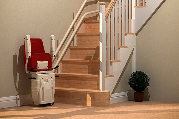 Curved stairlift parked at the bottom of a curve staircase