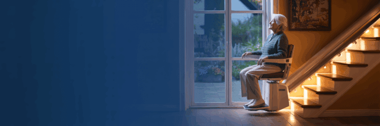 Woman using a stairlift fitted by a UK stairlift company