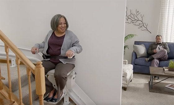 image of lady on stairlift in cambridgeshire